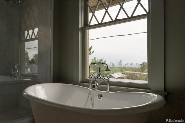 3330 Bruce Randolph Ave, Denver, CO 80205 - full bathroom with a soaking tub and a view of city