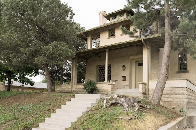 3330 Bruce Randolph Ave, Denver, CO 80205 - american foursquare style home with brick siding and a chimney