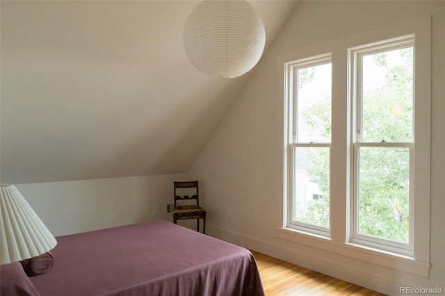 3330 Bruce Randolph Ave, Denver, CO 80205 - bedroom featuring vaulted ceiling and wood finished floors