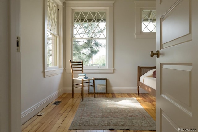 3330 Bruce Randolph Ave, Denver, CO 80205 - sitting room featuring plenty of natural light and light wood-type flooring
