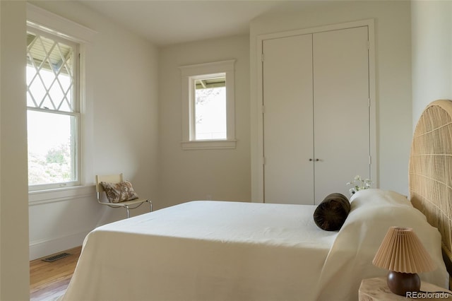 3330 Bruce Randolph Ave, Denver, CO 80205 - bedroom with wood finished floors and a closet