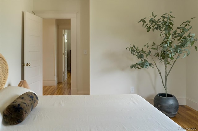 3330 Bruce Randolph Ave, Denver, CO 80205 - bedroom with wood finished floors and baseboards