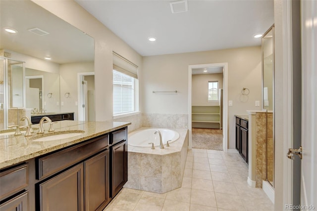 2454 Ambience Ln, Castle Rock, CO 80109 - full bath featuring vanity, a garden tub, tile patterned flooring, and recessed lighting