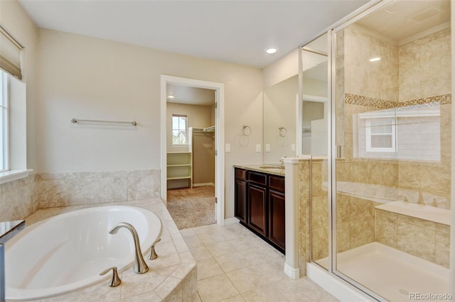 2454 Ambience Ln, Castle Rock, CO 80109 - full bath featuring vanity, a shower stall, a bath, a walk in closet, and tile patterned flooring