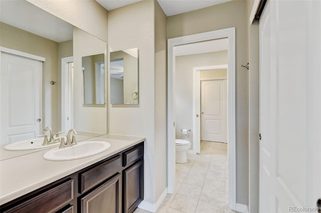 2454 Ambience Ln, Castle Rock, CO 80109 - bathroom featuring vanity, toilet, tile patterned floors, and baseboards