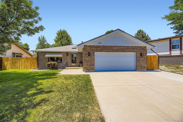 3245 S Kendall St, Denver, CO 80227 - ranch-style house featuring an attached garage, driveway, and brick siding