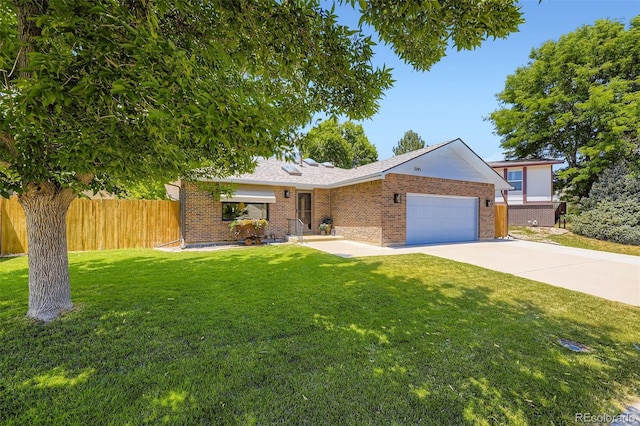 3245 S Kendall St, Denver, CO 80227 - single story home with a garage, brick siding, and driveway