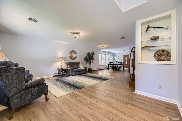 3245 S Kendall St, Denver, CO 80227 - living room featuring wood finished floors and baseboard heating
