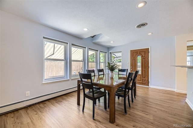 3245 S Kendall St, Denver, CO 80227 - dining room featuring baseboard heating, light wood-style flooring, recessed lighting, and a textured ceiling