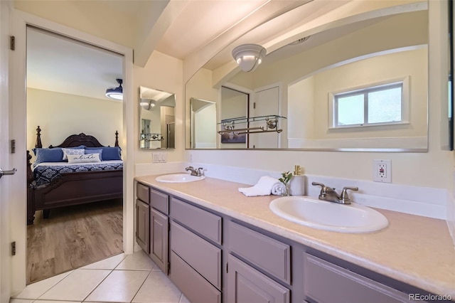 3245 S Kendall St, Denver, CO 80227 - ensuite bathroom featuring double vanity and tile patterned flooring