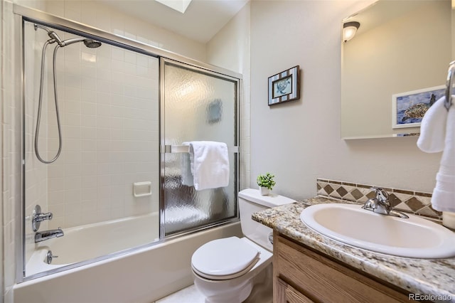 3245 S Kendall St, Denver, CO 80227 - full bathroom featuring vanity, decorative backsplash, and bath / shower combo with glass door