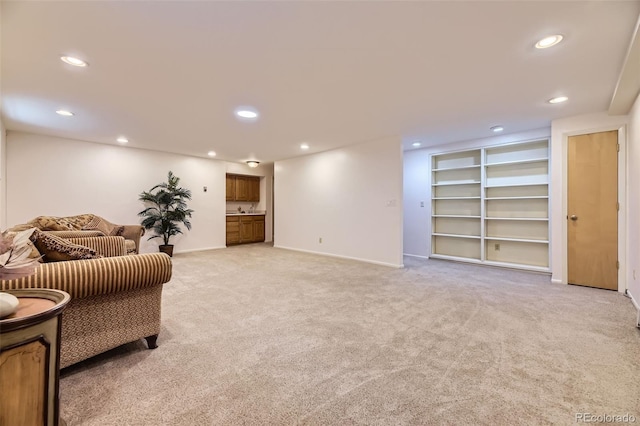 3245 S Kendall St, Denver, CO 80227 - sitting room featuring light colored carpet, recessed lighting, and built in features