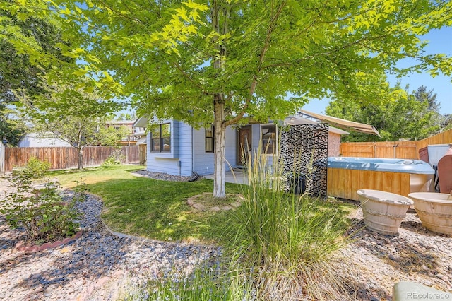 3245 S Kendall St, Denver, CO 80227 - fenced backyard featuring a hot tub