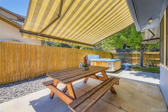 3245 S Kendall St, Denver, CO 80227 - fenced backyard featuring a patio area, a hot tub, and outdoor dining area