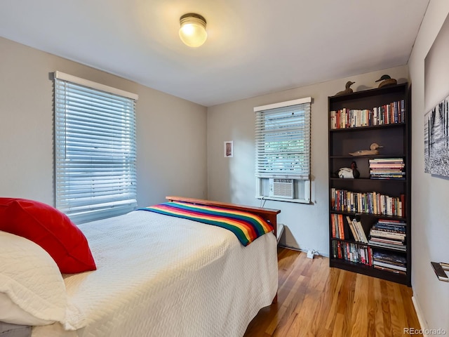 2626 N Steele St, Denver, CO 80205 - bedroom with wood finished floors and cooling unit
