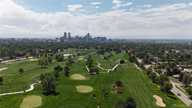 2626 N Steele St, Denver, CO 80205 - aerial overview of property's location featuring city skyline, a large body of water, and a golf course