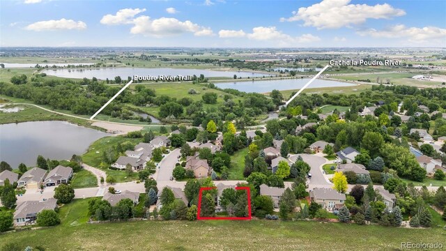 2037 River W Dr, Windsor, CO 80550 - aerial perspective of suburban area with property boundaries highlighted and a large body of water