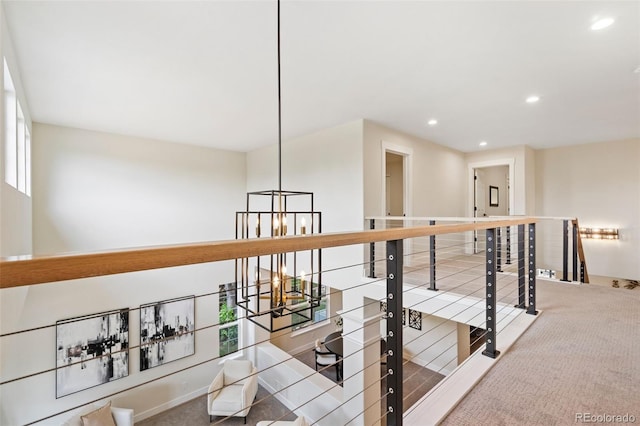 2037 River W Dr, Windsor, CO 80550 - hall featuring an upstairs landing, recessed lighting, a chandelier, and carpet floors