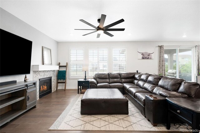 14454 Grape Way, Thornton, CO 80602 - living area with a ceiling fan, light wood finished floors, a fireplace, recessed lighting, and baseboards