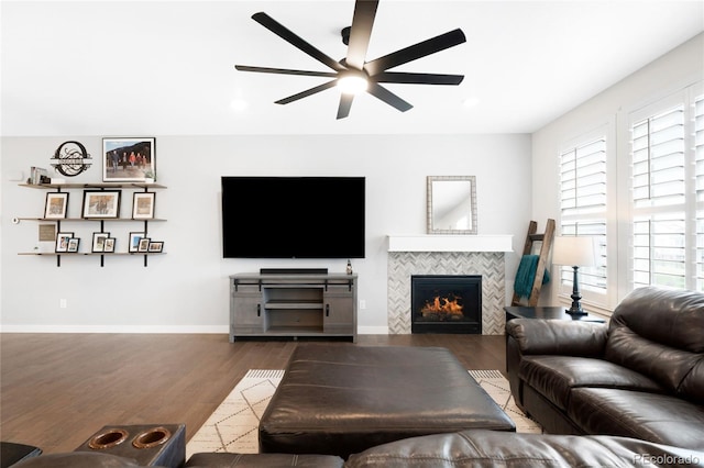 14454 Grape Way, Thornton, CO 80602 - living area with a ceiling fan, wood finished floors, healthy amount of natural light, a tile fireplace, and recessed lighting