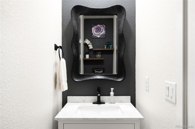 14454 Grape Way, Thornton, CO 80602 - bathroom featuring vanity and a textured wall