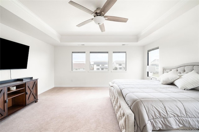 14454 Grape Way, Thornton, CO 80602 - bedroom featuring a tray ceiling, crown molding, light colored carpet, multiple windows, and baseboards