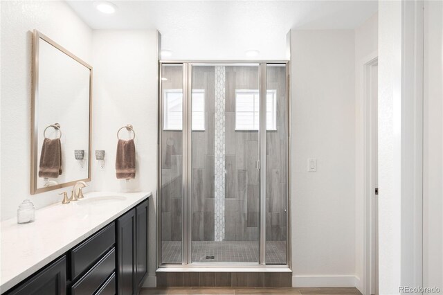 14454 Grape Way, Thornton, CO 80602 - bathroom featuring vanity and a stall shower