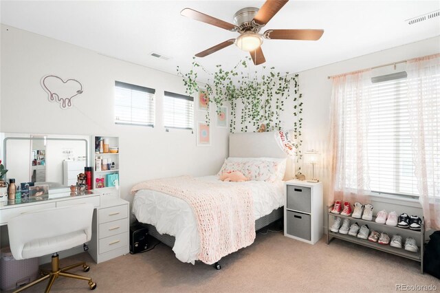14454 Grape Way, Thornton, CO 80602 - bedroom featuring light carpet, an office area, and ceiling fan