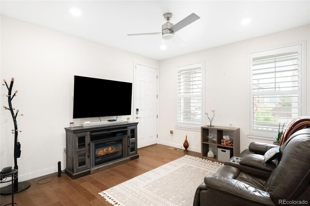14454 Grape Way, Thornton, CO 80602 - living room featuring a ceiling fan, baseboards, wood finished floors, and recessed lighting
