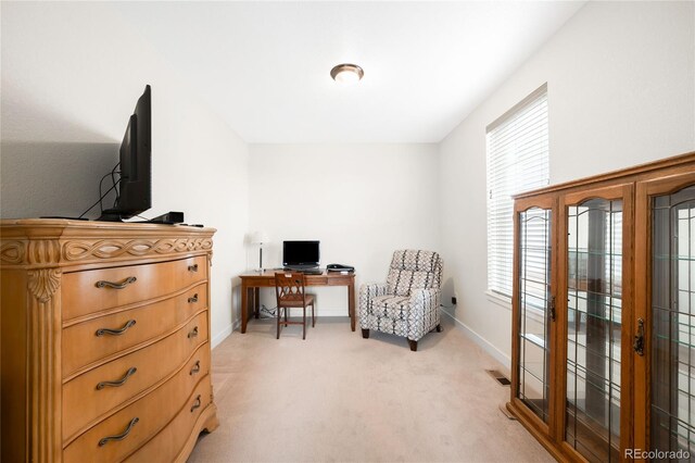 14454 Grape Way, Thornton, CO 80602 - living area featuring an office area, light colored carpet, baseboards, and french doors