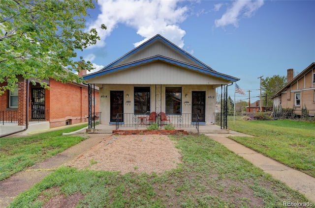 4514 Bryant St, Denver, CO 80211 - view of front of property with a porch and a front lawn
