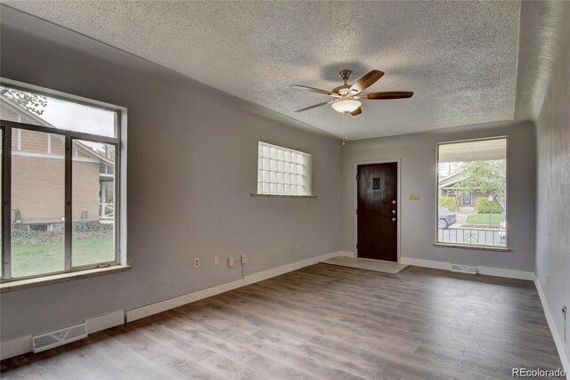 4514 Bryant St, Denver, CO 80211 - spare room with a textured ceiling, ceiling fan, wood finished floors, and baseboards