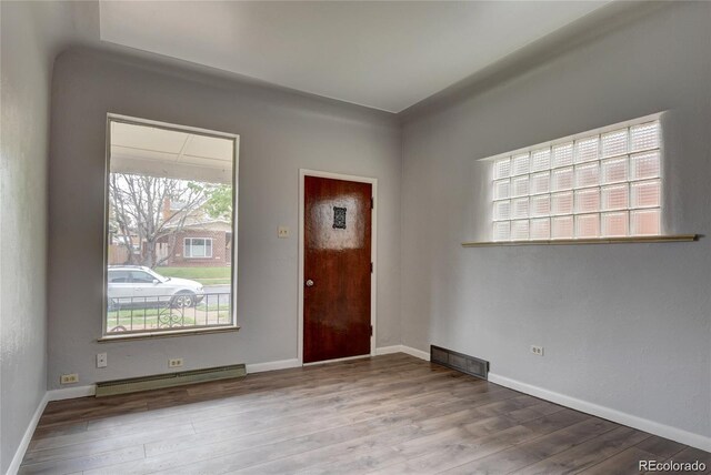 4514 Bryant St, Denver, CO 80211 - entryway featuring baseboard heating, wood finished floors, and baseboards