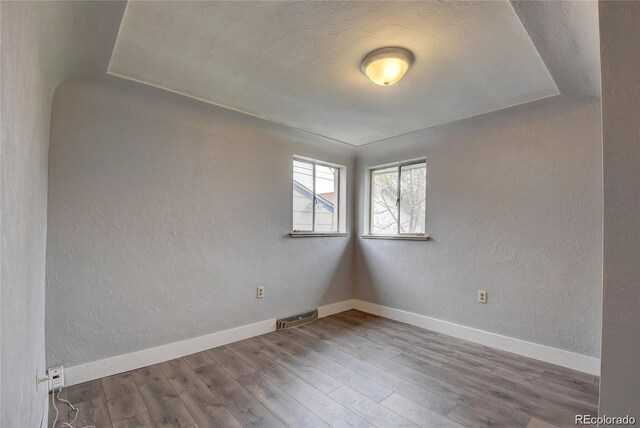 4514 Bryant St, Denver, CO 80211 - spare room featuring wood finished floors, a textured wall, and baseboards