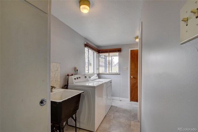 4514 Bryant St, Denver, CO 80211 - laundry room with separate washer and dryer and baseboards