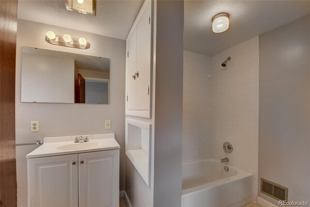 4514 Bryant St, Denver, CO 80211 - full bathroom featuring vanity, tub / shower combination, and a textured ceiling