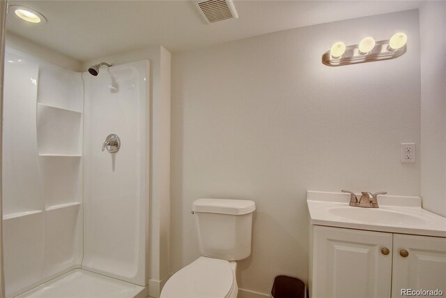 4514 Bryant St, Denver, CO 80211 - full bath featuring a shower, toilet, vanity, and baseboards