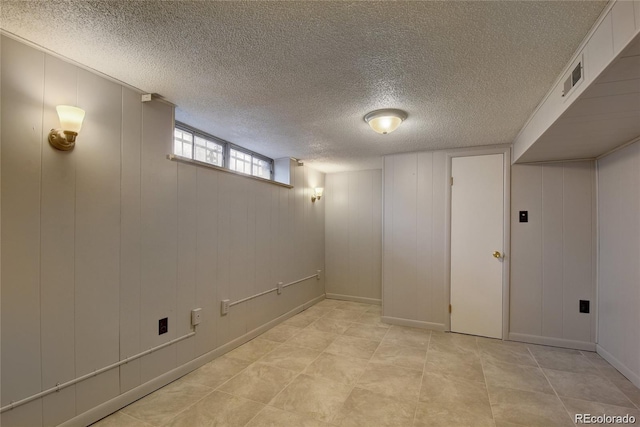 4514 Bryant St, Denver, CO 80211 - basement featuring a textured ceiling and a decorative wall