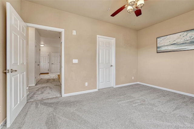 unfurnished bedroom featuring ceiling fan and light colored carpet