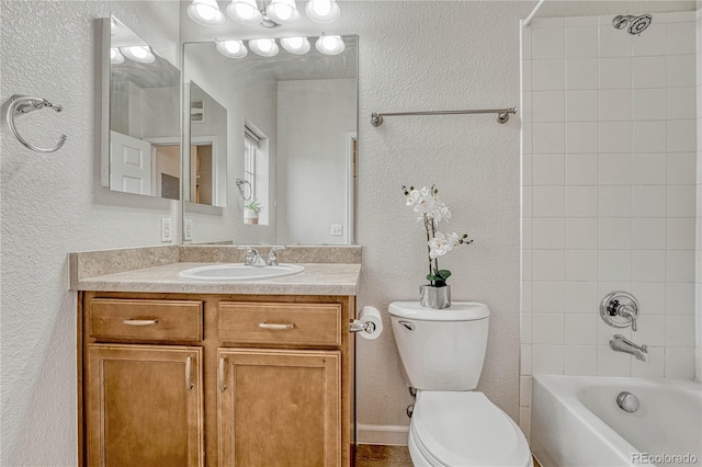 full bathroom with tiled shower / bath combo, vanity, and toilet