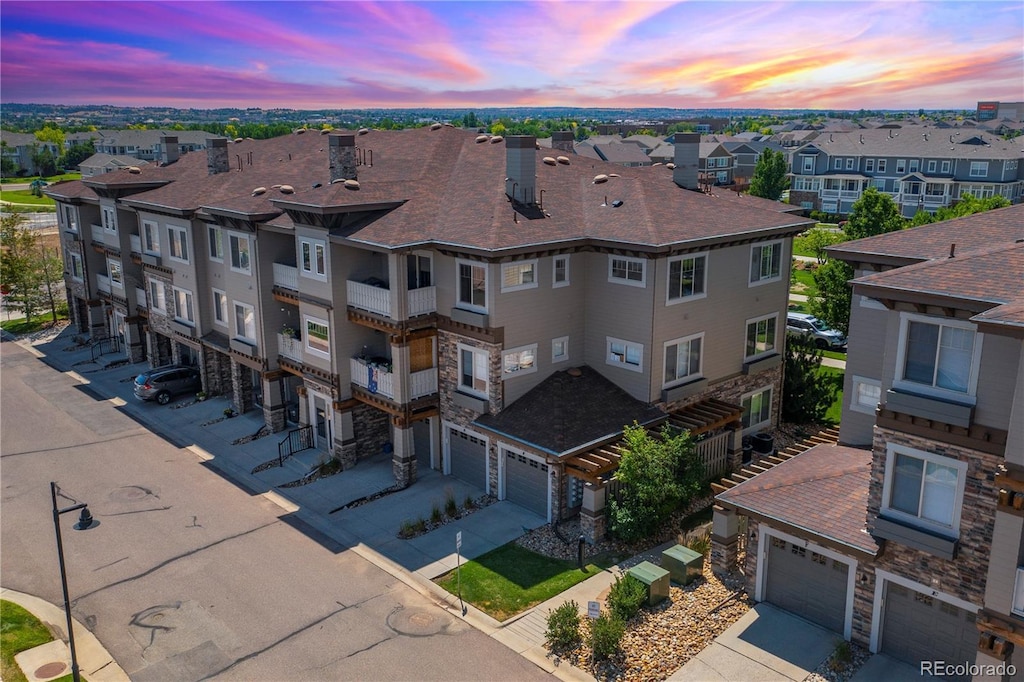 aerial view at dusk with a residential view