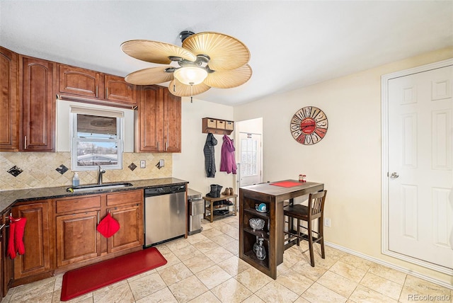 kitchen with light tile patterned flooring, sink, tasteful backsplash, stainless steel dishwasher, and ceiling fan