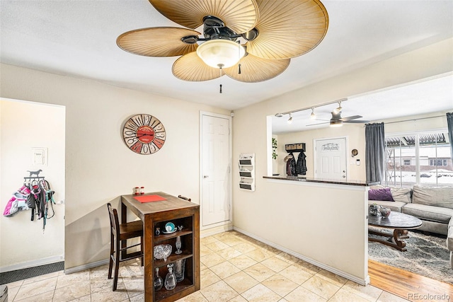 interior space featuring ceiling fan