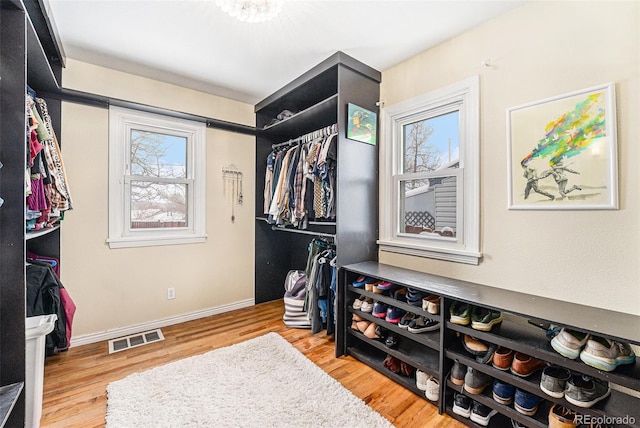 walk in closet featuring light hardwood / wood-style floors