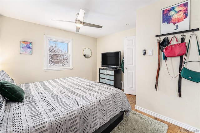 bedroom featuring ceiling fan and hardwood / wood-style floors