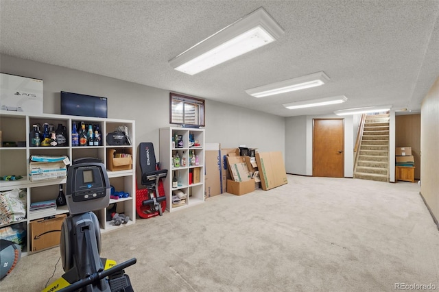 interior space featuring a textured ceiling and light colored carpet