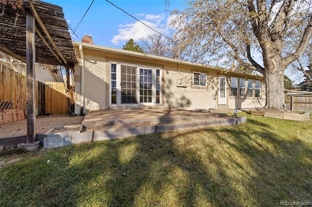 rear view of property with a yard and cooling unit