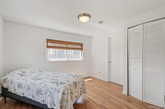 2252 Lamar St, Edgewater, CO 80214 - bedroom featuring light wood-type flooring, a closet, and baseboards