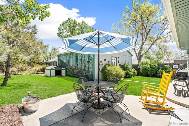 2252 Lamar St, Edgewater, CO 80214 - view of patio with outdoor dining space, an outbuilding, and a storage unit