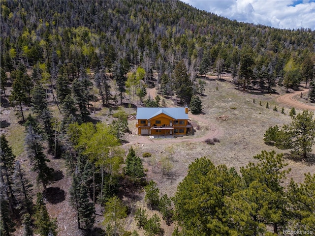 bird's eye view featuring a forest view